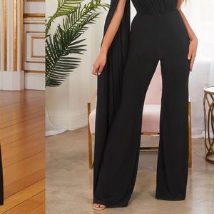 Black one shoulder cape sleeve jumpsuit